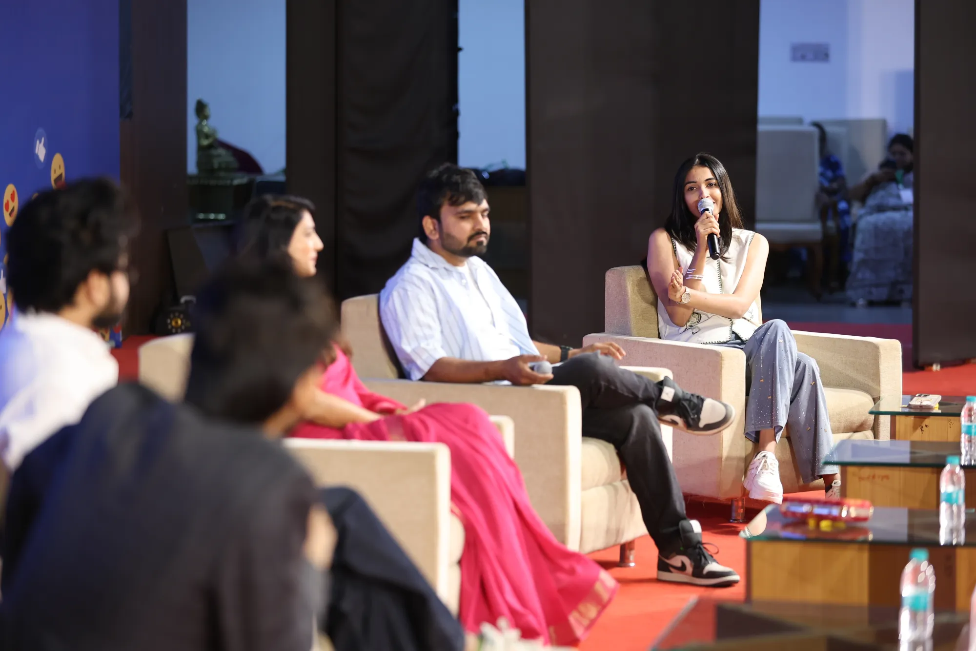 Group sitting in a circle holding paper scripts